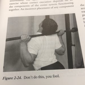 A photo from Mark Rippetoe's Starting Strength showing bad squat form captioned "Don't do this, you fool."