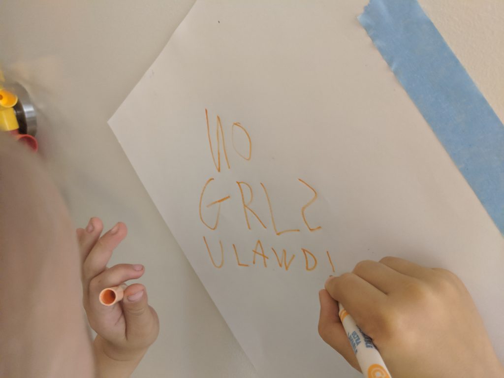 Max scrawls out "NO GRLS  ULAWD!" for his door.