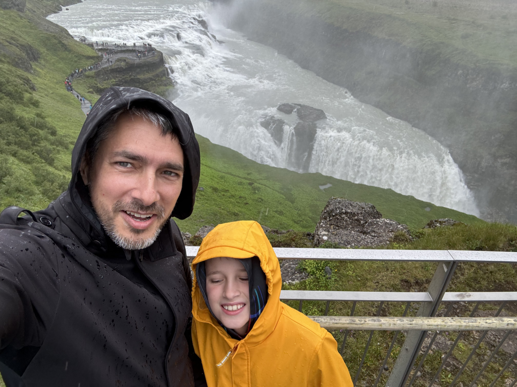 Matt and Max selfie against the river flowing to become the Gullfoss