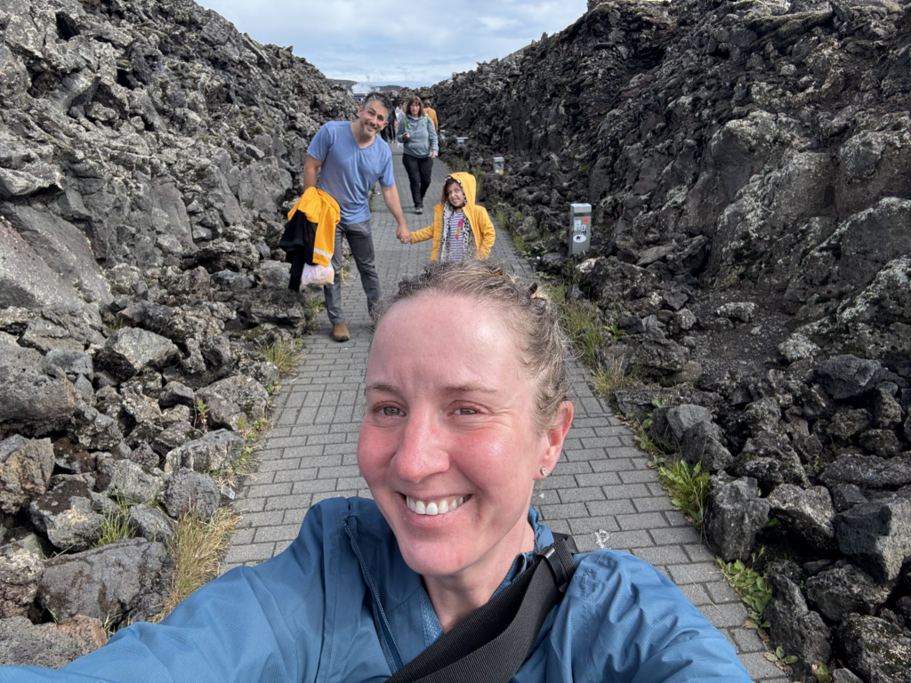 Sam selfie in the volcanic pathway from the blue lagoon with Matt and Z in the background