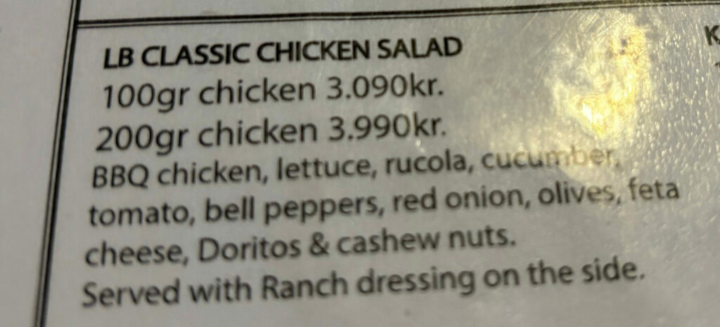 a menu featuring a "classic chicken salad" featuring bbq chicken and doritos.